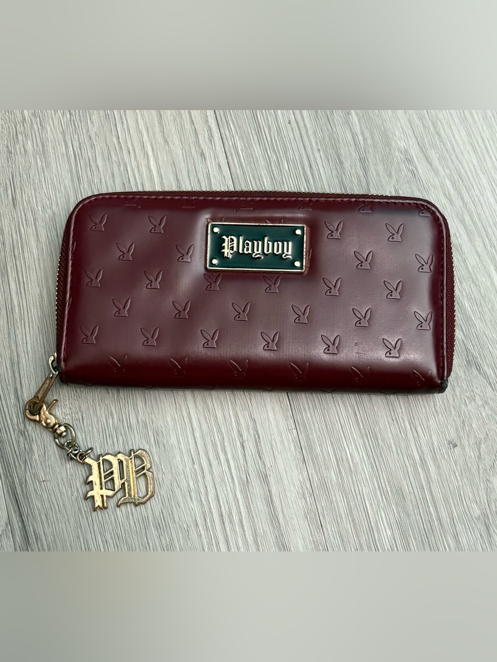 PLAYBOY Burgundy Embossed Zip Card Holder with Gold Charm